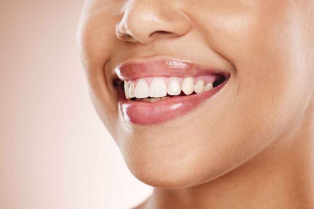 Woman displaying bright white teeth and a healthy smile.